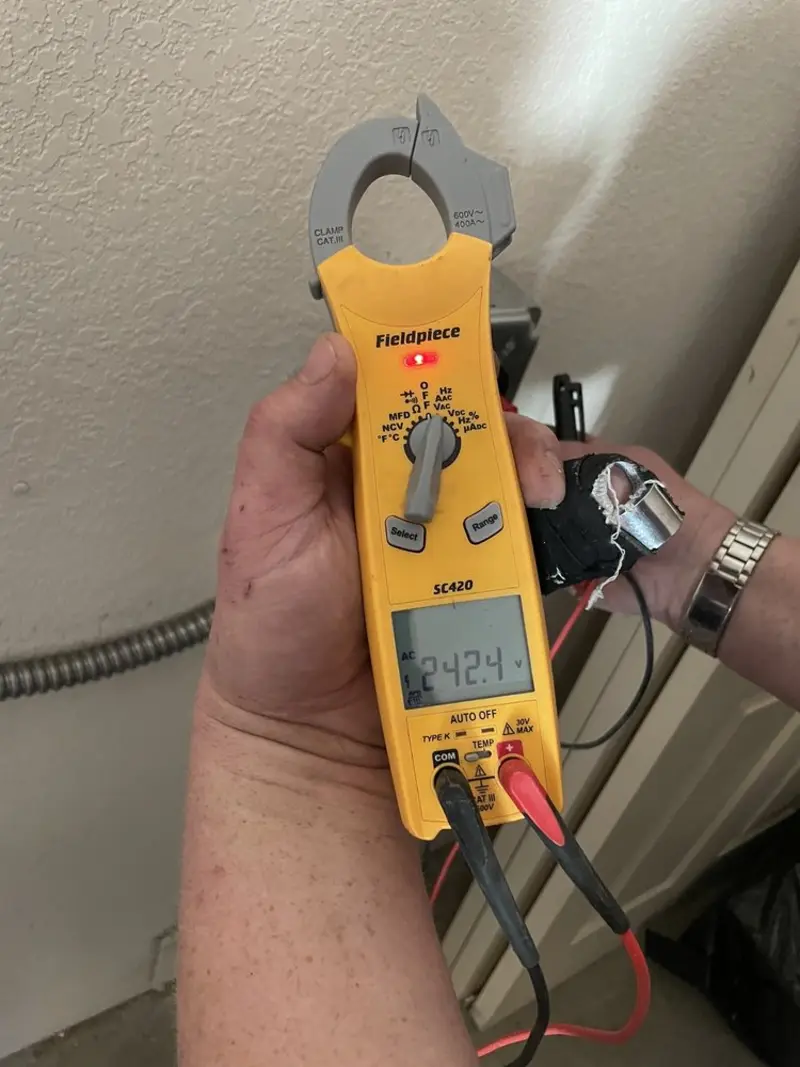 Voltage testing with clamp meter during Electrical Installation Services in Bay Harbor Islands